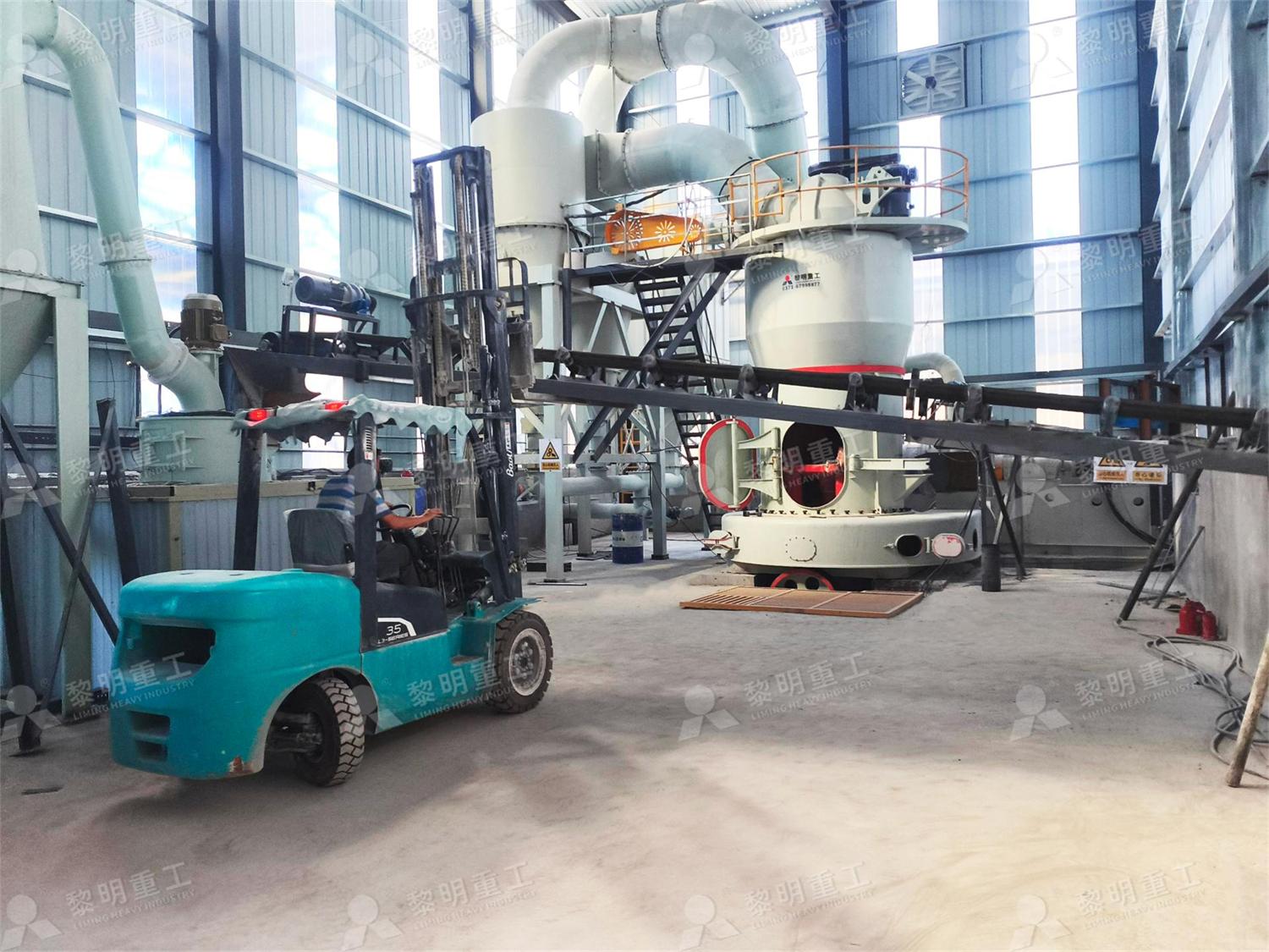 Full view of barite powder grinding production line workshop with forklift